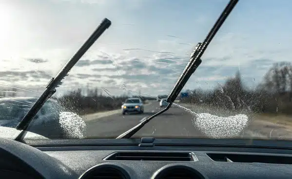 <a href="https://www.freepik.com/free-photo/car-wipers-clean-windshields-when-driving-sunny-weather_22445438.htm#query=wiper%20fluid&position=3&from_view=search&track=ais">Image by pvproductions</a> on Freepik